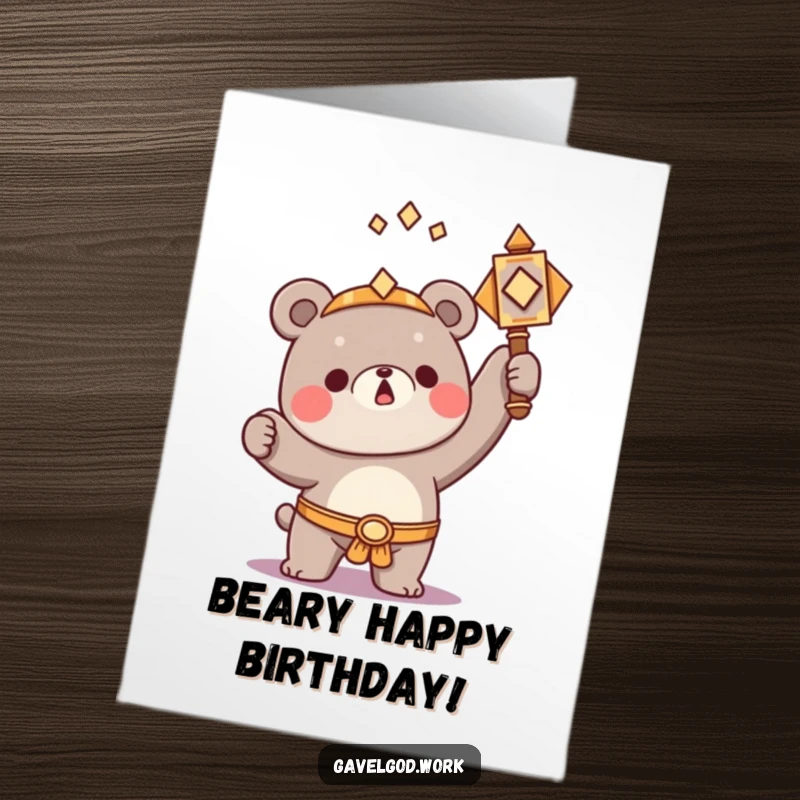 Funny Free Printable Birthday Card: A kawaii bear character triumphantly raising an ornate hammer, celebrating a successful birthday.